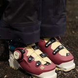 K2 Mindbender 95 BOA ski boots feature a yellow and white color scheme with visible BOA dials.