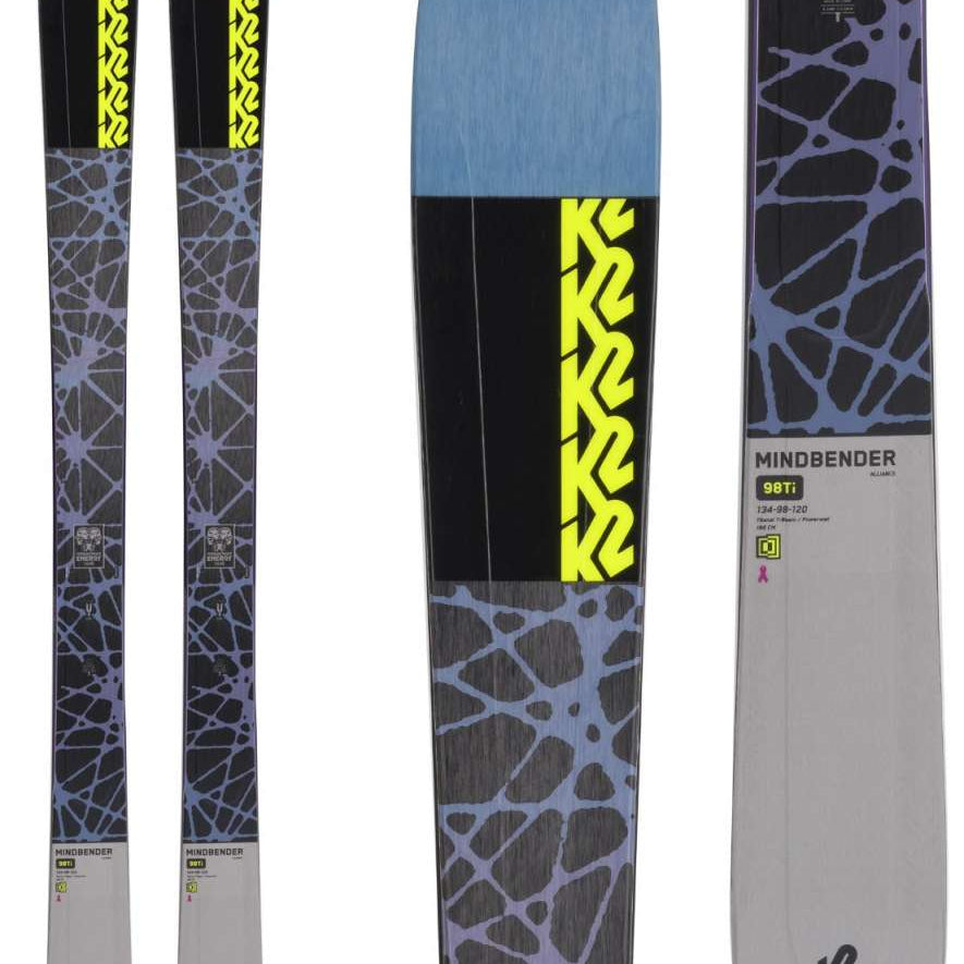 Two pairs of K2 Ladies Mindbender 98Ti Alliance Flat Skis for the 2021-2022 season, with a black and white camouflage pattern on top.