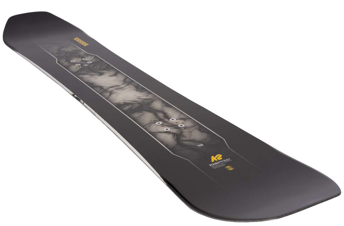 K2 Manifest snowboard features a dark graphic design with white accents.