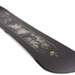 K2 Manifest snowboard features a dark graphic design with white accents.