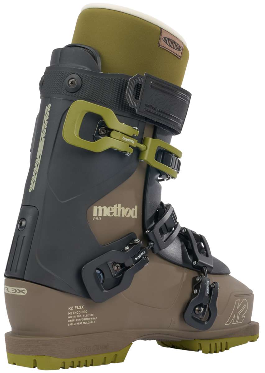 K2 Method Pro 100 ski boot features a black and green design with visible hardware.