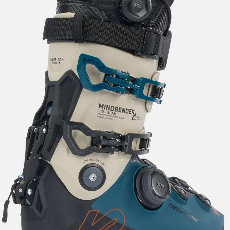 K2 Mindbender 130 BOA ski boot features a black and blue design with a visible adjustment dial.