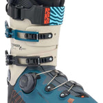 K2 Mindbender 130 BOA ski boot features a blue and white striped design with a red accent.