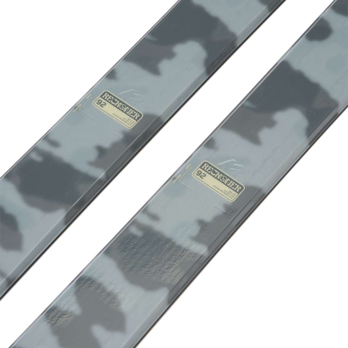 K2 Reckoner 92 skis 2024 feature a red and white design with a textured surface.