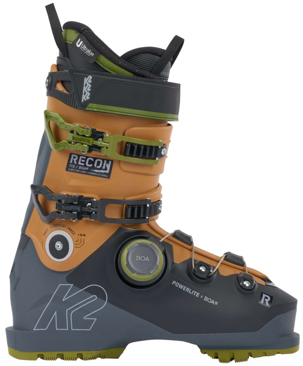 K2 Recon 110 BOA ski boots feature a black and orange design with visible BOA adjustment dials.