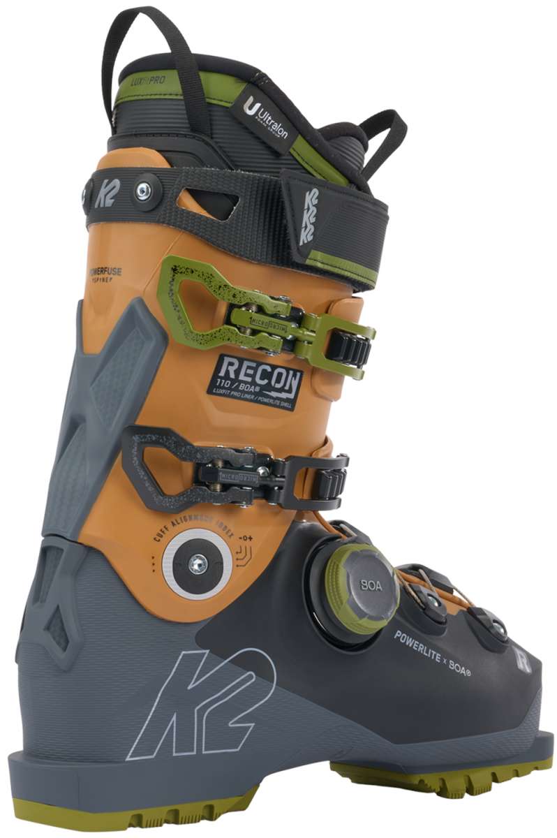 K2 Recon 110 BOA ski boots feature a black and orange design with visible BOA dial closures.