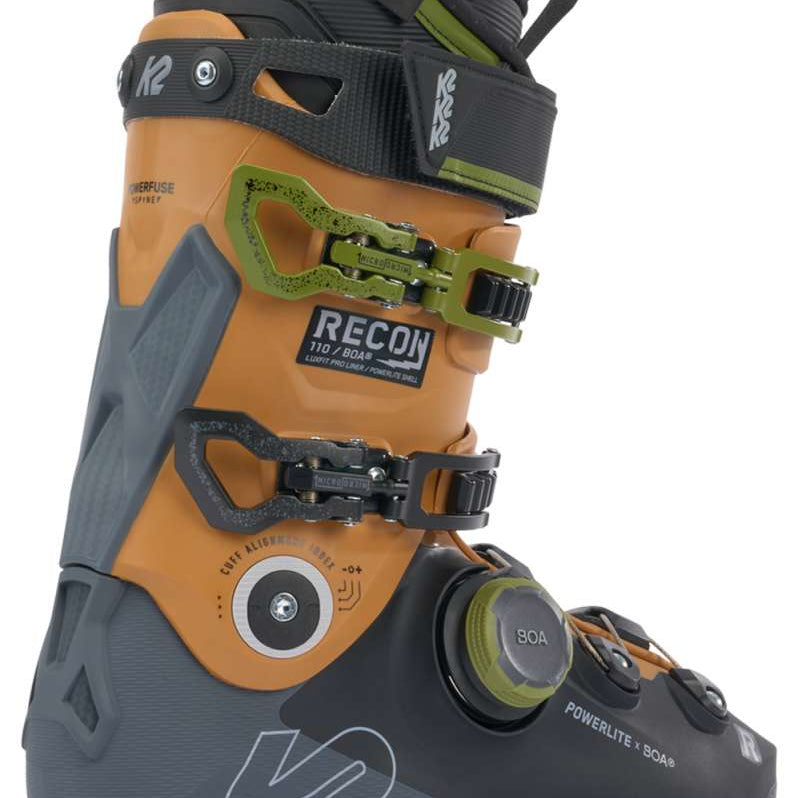 K2 Recon 110 BOA ski boots feature a black and orange design with visible BOA dial closures.