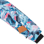 Kamik Junior's Tallie Floressence Jacket - A blue and pink floral patterned jacket with a brown tag on the sleeve.