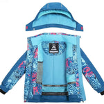 Kamik Girls Koko Insulated Jacket 2024 - A blue and pink snowflake patterned jacket with a hood, featuring a zipper closure on the front.
