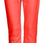 Killtec Women's Jilia Soft Shell Pants 2024 - A pair of coral-colored pants with a black waistband and belt loops, featuring a subtle pattern on the left thigh.