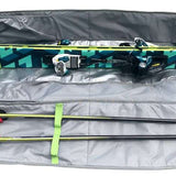 Kulkea Kantaja Ski Bag 2022-2023 - A black ski bag with a blue and green geometric pattern on the front, featuring two zippered compartments and a handle for easy carrying.