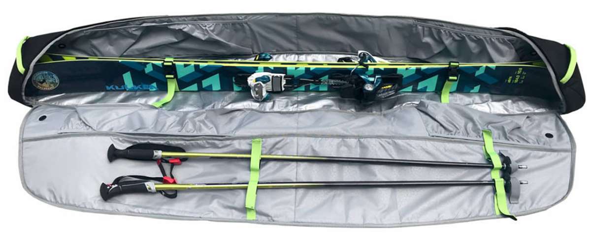 Kulkea Kantaja Ski Bag 2022-2023 - A black ski bag with a blue and green geometric pattern on the front, featuring two zippered compartments and a handle for easy carrying.