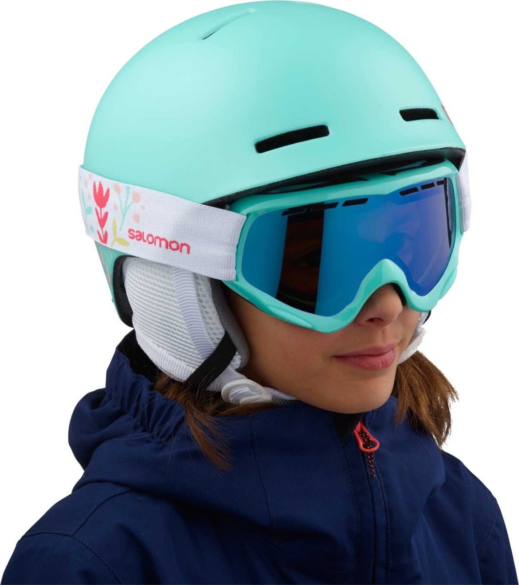 Salomon Juniors' Grom Helmet 2020 - A mint green helmet with a white strap and red logo on the side.
