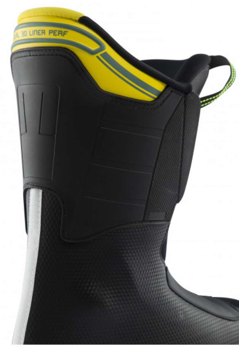 Lange RX 110 MV Ski Boot 2023 - A black ski boot with a yellow and gray stripe on top.