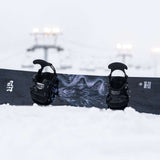 Lib Tech Skunk Ape Camber Snowboard - Black snowboard with white logo and abstract design on top of a snowy surface.