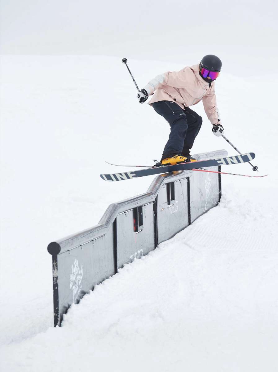 Line Women's Honey Bee Flat Ski 2022-2023 - A black ski with a white bee logo on the top of the front binding.