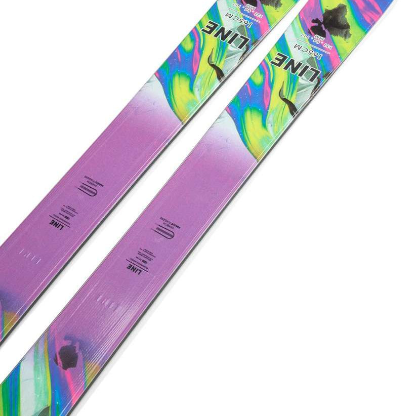 Line Women's Pandora 94 Skis 2024 - A pair of skis with a purple base and a colorful, abstract design featuring green, blue, pink, yellow, and black swirls.