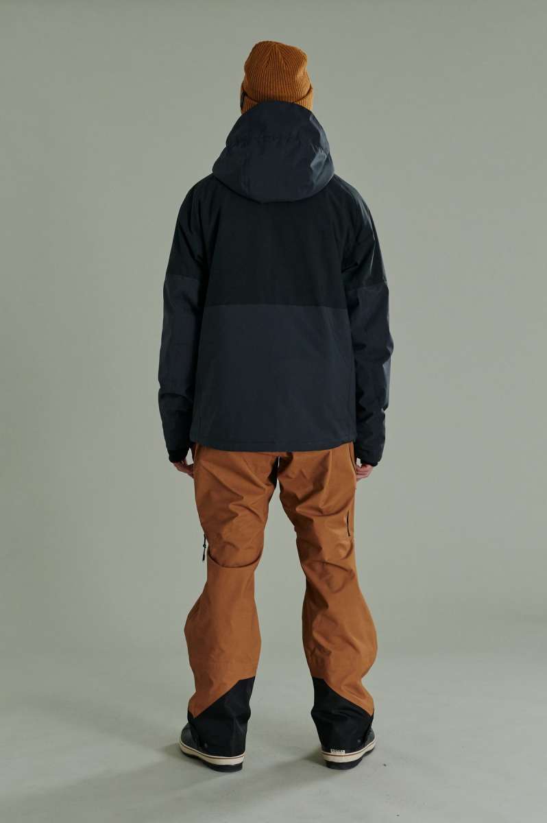 Liquid Anton Pro Stretch Jacket 2022-2023 - A black jacket with a high collar and zippered pockets on either side.