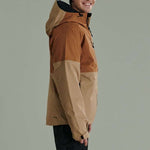 Liquid Anton Pro Stretch Jacket - A tan-colored jacket with a black zipper and black drawstring at the hood.