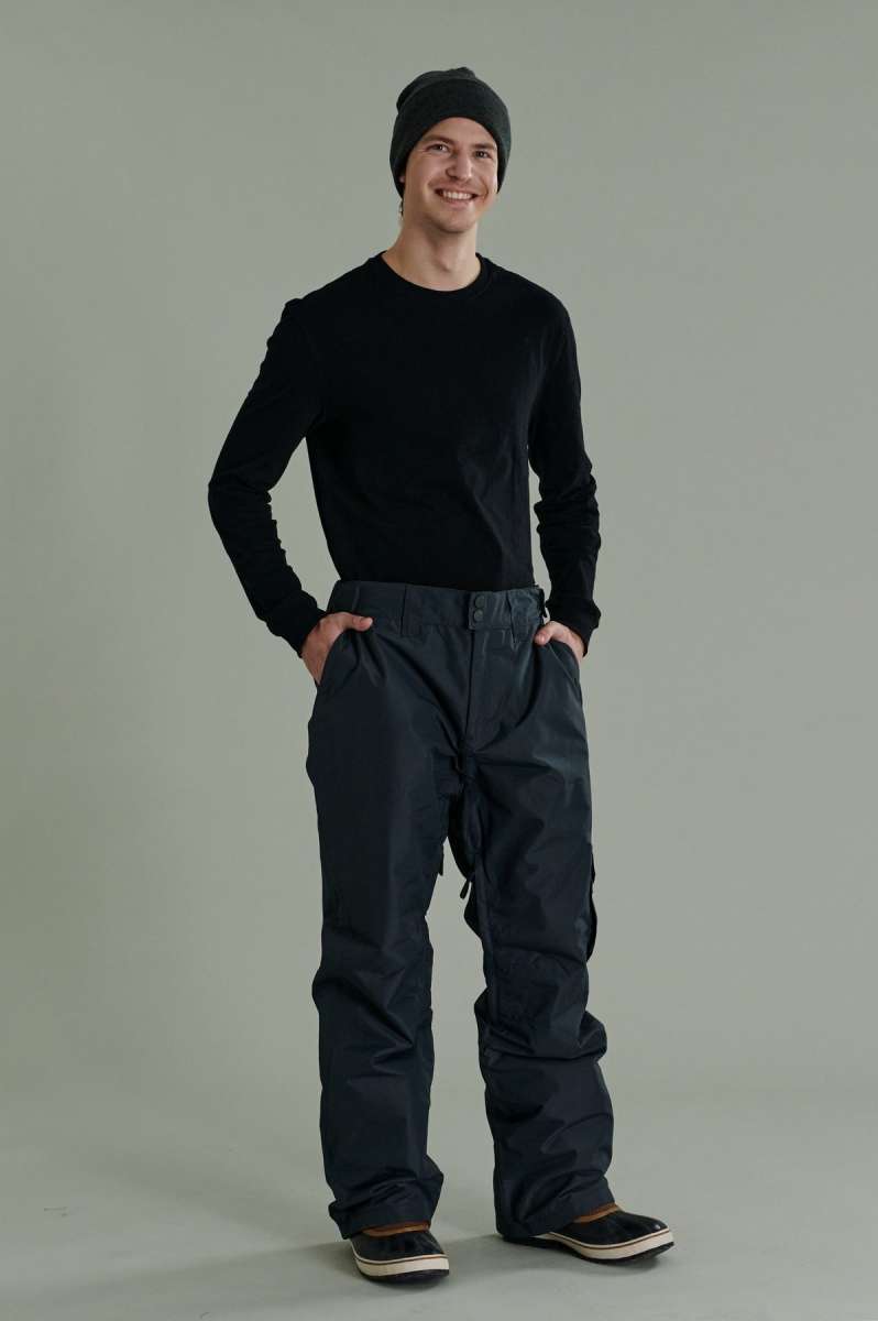 Liquid Express Insulated Pants - Dark-colored insulated pants with a zippered pocket on the side of one leg.