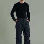 Liquid Express Insulated Pants - Dark-colored insulated pants with a zippered pocket on the side of one leg.