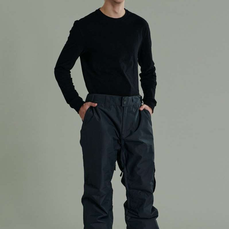 Liquid Express Insulated Pants - Dark-colored insulated pants with a zippered pocket on the side of one leg.