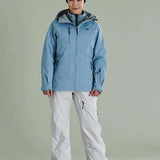 Liquid Women's Atna Pro 3 Layer Jacket - Light blue jacket with black zipper and logo on chest, gray hood lining, and two zippered pockets.