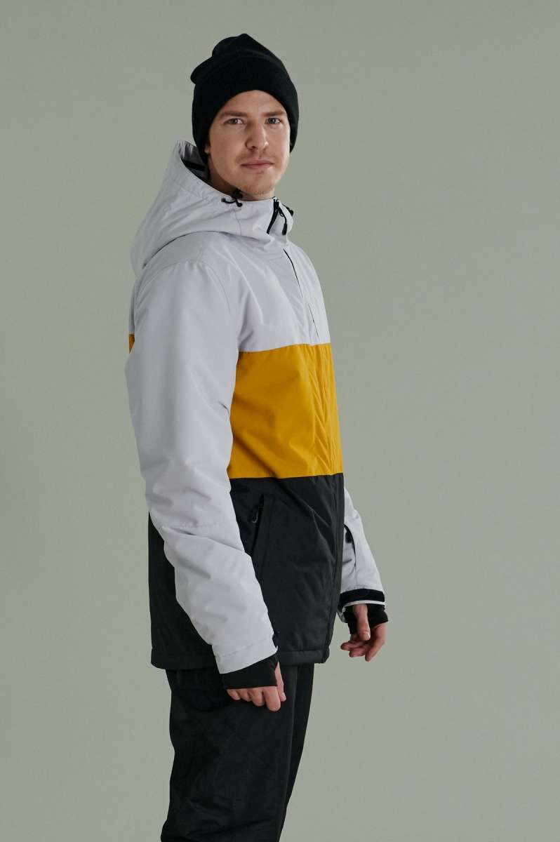 Liquid Maverick Insulated Jacket - A white, black, and yellow jacket with a hood, featuring a zipper closure on the front.