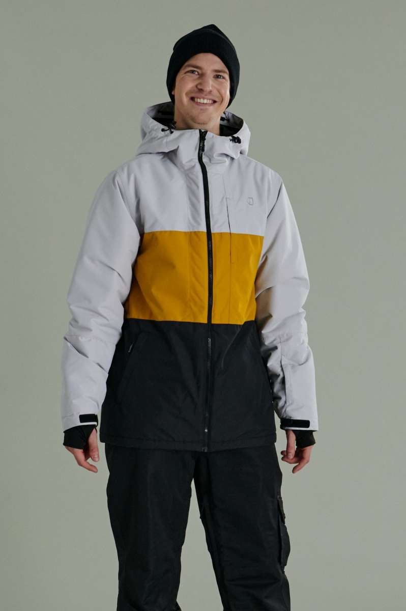 Liquid Maverick Insulated Jacket - A white, yellow, and black jacket with a hood, featuring a zippered front and two side pockets.