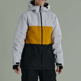 Liquid Maverick Insulated Jacket - A white, yellow, and black jacket with a hood, featuring a zippered front and two side pockets.