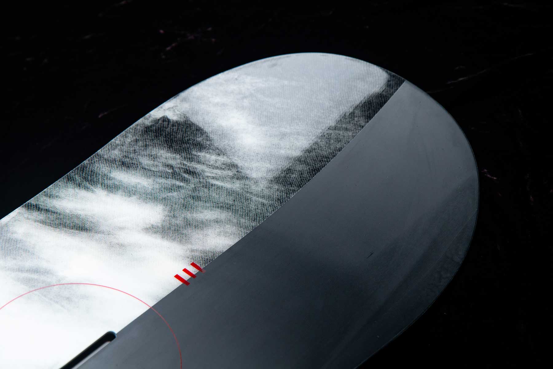 Endeavor Live Snowboard 2020 - A black snowboard with a white and gray abstract design on its top sheet.