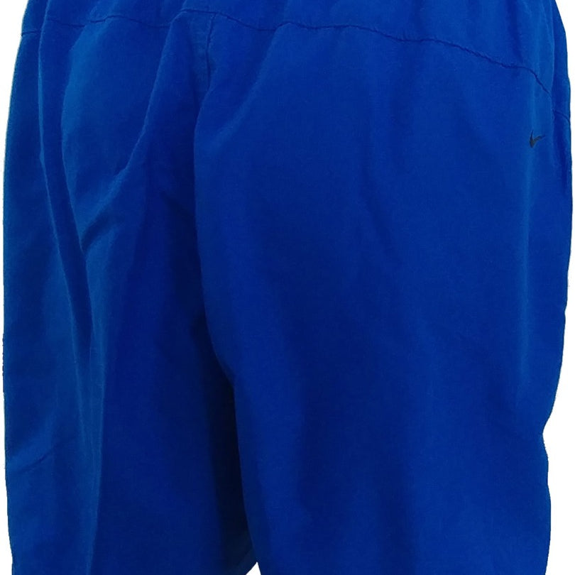 Nike Men's Hydra Void Solid 7" Board Shorts - A pair of royal blue board shorts with a solid pattern and an elastic waistband.