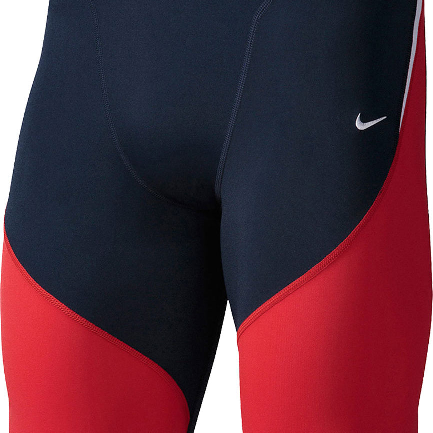 Nike Swim Men's Poly Color Surge Jammer Swimsuit - A navy blue and red swimsuit with a white Nike logo on the left leg.