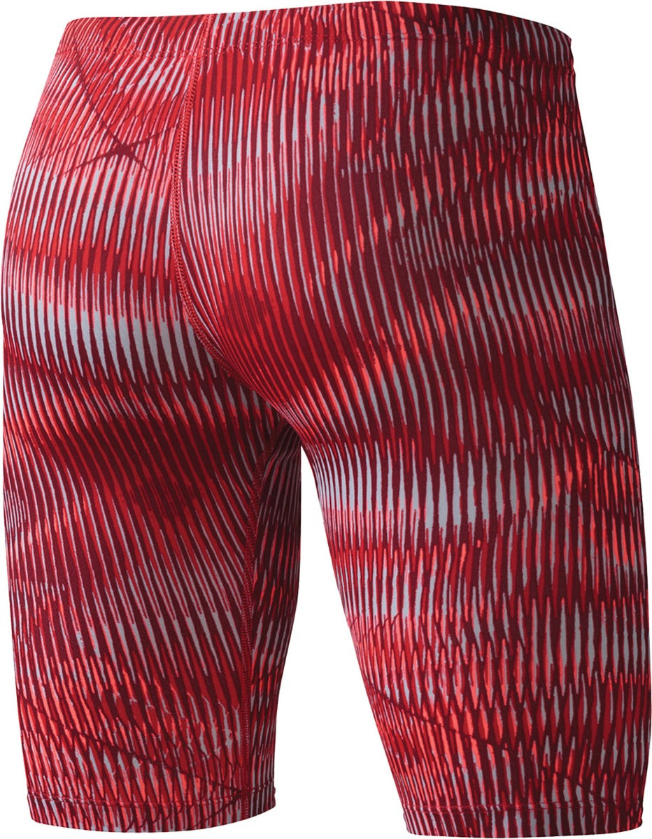 Nike Swim Men's Vibe Jammer Swimsuit - A red and black swimsuit with a geometric pattern of lines on the fabric, featuring a solid color background.