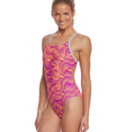 Nike Swim Ladies' Far Out Cut-Out Tank One-Piece Swimsuit - A pink and orange one-piece swimsuit with cut-outs on the sides, featuring a tank-style top and a high-cut leg.