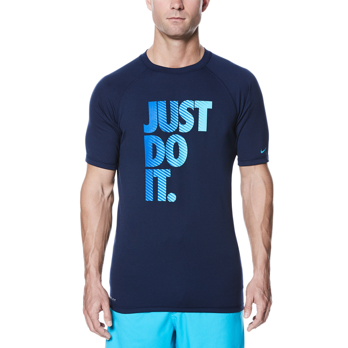Nike Men's Just Do It Fade Hydro UV Short Sleeve Rashguard Shirt - A navy blue rash guard with a faded "Just Do It" logo in light blue and white across the chest.