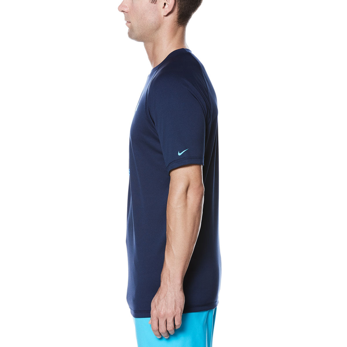 Nike Men's Just Do It Fade Hydro UV Short Sleeve Rashguard Shirt - A navy blue rash guard shirt with a faded "Just Do It" logo on the front and a small white Nike swoosh on the left sleeve.