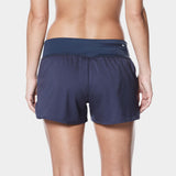 Nike Swim Ladies' Solid Element Board Shorts Bottom Two-Piece Swimsuit - A pair of navy blue swim shorts with a zippered pocket on the side and a small white logo near the top right corner.