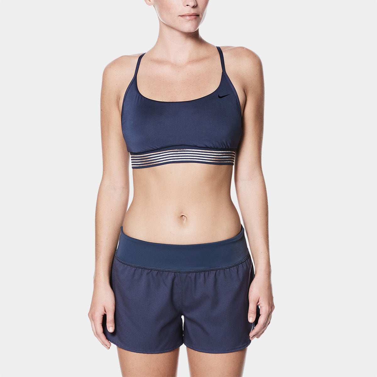 Nike Swim Ladies' Solid Element Board Shorts Bottom Two-Piece Swimsuit - A two-piece swimsuit with a solid-colored pair of board shorts and a matching top.