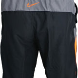 Nike Swim Men's 9" Spliced Volley Swim Shorts - A pair of men's swim shorts with a spliced design, featuring a combination of solid and striped patterns in shades of blue and white.