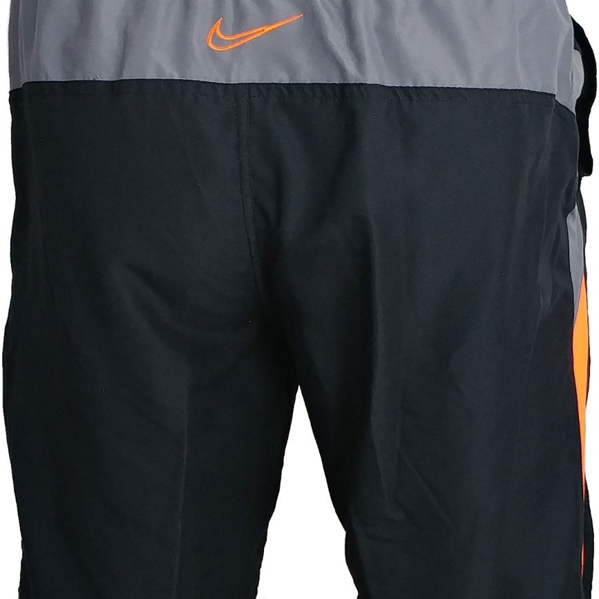 Nike Swim Men's 9" Spliced Volley Swim Shorts - A pair of men's swim shorts with a spliced design, featuring a combination of solid and striped patterns in shades of blue and white.