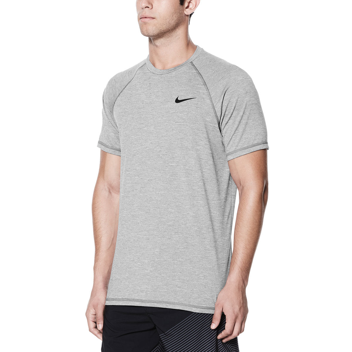 Nike Swim Men's Hydroguard Heather Short Sleeve T-Shirt - A heather grey short-sleeved t-shirt with a crew neck and small black Nike logo on the left chest.