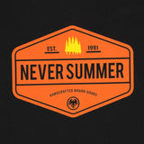 Never Summer Workwear 2 Short Sleeve Tee 2024 - A short-sleeved orange t-shirt with a white logo on the chest and a small tag near the bottom hem.