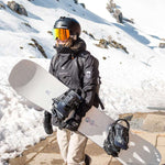 Nidecker Women's Venus Snowboard 2023 - A white snowboard with a pink logo and black bindings.
