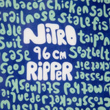 Nitro Junior's Ripper Snowboard 2023 - A blue snowboard with a white logo and black text that reads "Ripper" on top of a white rectangle.