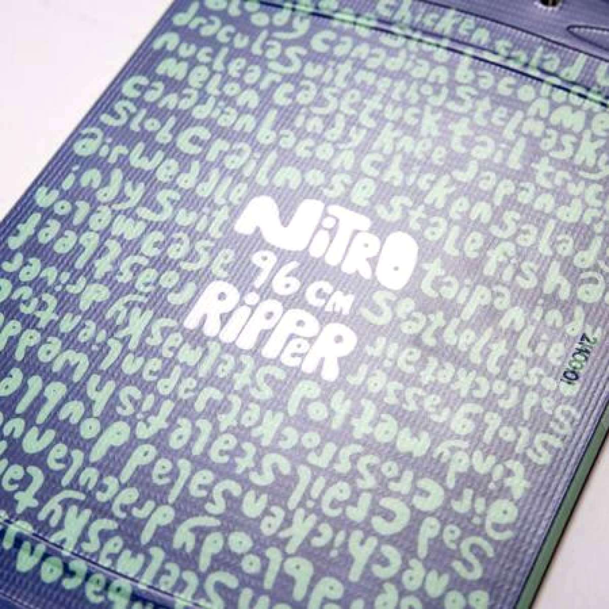 Nitro Junior's Ripper Snowboard 2023 - A snowboard with a black base and yellow accents, featuring a ripper graphic on top.