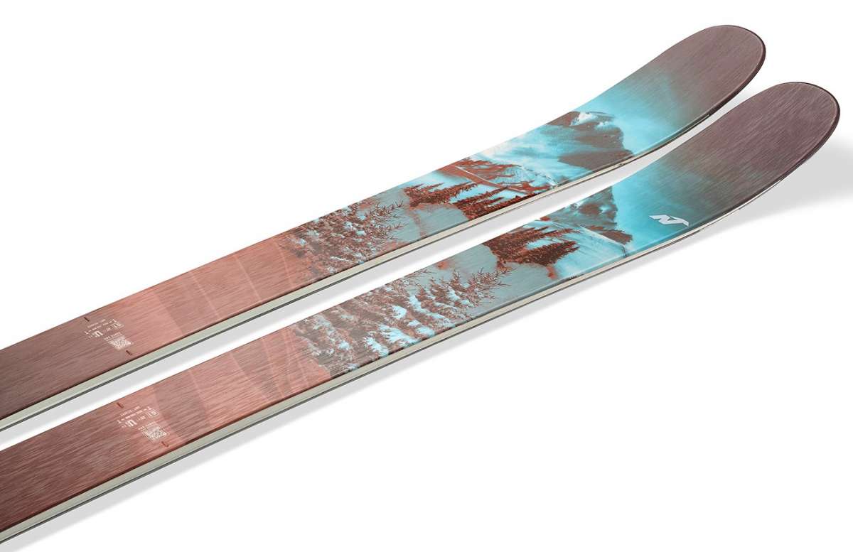 Nordica Ladies Santa Ana 104 Free Skis 2024 - A pair of skis with a light blue graphic featuring trees and mountains on a white background.