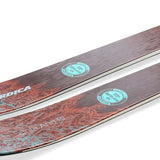 Nordica Ladies Santa Ana 104 Free Skis 2024 - A pair of skis with a brown and blue marbled pattern on the tips, featuring white lettering that reads "Santa Ana" in cursive.