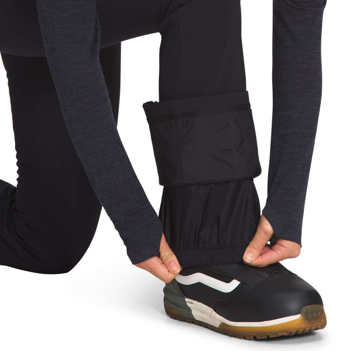 North Face Amy Softshell Pant Short 2022-2023 - A pair of black softshell pants with a zippered ankle pocket on the right leg.