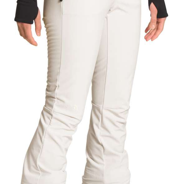 North Face Amy Softshell Pant Short 2022-2023 - A pair of white snow pants with a black zipper on the left side, featuring a zippered pocket and a small black logo near the right hip.